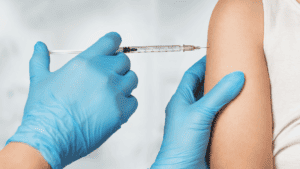 Injection of a shot/pharmaceutical or vaccination during clinical research medical trial